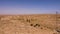 Panoramic view sandy valley on blue sky background in Sahara desert