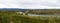 Panoramic View of Scenic River and Trees on a Clear Fall Day