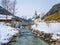 Panoramic view of scenic winter landscape in the Bavarian Alps with famous Parish Church of St. Sebastian in the village of Ramsau