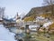 Panoramic view of scenic winter landscape in the Bavarian Alps with famous Parish Church of St. Sebastian in the village of Ramsau