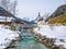 Panoramic view of scenic winter landscape in the Bavarian Alps with famous Parish Church of St. Sebastian in the village of Ramsau