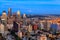 Panoramic view of Seattle skyline at blue hour from Space Needle Tower, Mt. Rainier in the background. Seattle, Washington, USA.