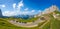 Panoramic view of Sella pass located at 2240 m above sea level, between the Sassolungo group and the Sella group and with flowerin