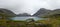 Panoramic view of a serene mountain lake in Norway