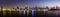 Panoramic view of Sharjah waterfront cityscape in UAE at dusk