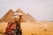 Panoramic view of the six great pyramids of Egypt with a camel in front. Pyramid of Khafre, pyramid of Khufu, and the red pyramid.