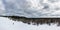 Panoramic view of skier down the hill in forest