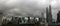 Panoramic view of skyscrappers in Kuala Lumpur, cloudy and rainy sky.