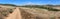 Panoramic view of small dry dusty trails in the valley