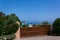 Panoramic view of small pevero beach with yacht