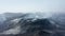 Panoramic view of smoking volcanic landscape after eruption. Solid lava streams on hill slopes. Fagradalsfjall volcano