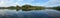 Panoramic view: Snake River reflecting the Rocky Mountains and the sky