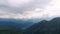 Panoramic view of the snow-capped peaks of the Caucasus mountains.