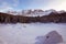 Panoramic view of snow covered lake carezza lago di carezza, karersee and latemar in winter; unesco world heritage, dolomites