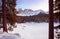 Panoramic view of snow covered lake carezza lago di carezza and latemar in winter; unesco world heritage, dolomites