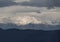 Panoramic view of snow covered Parnassus Mountains on a sunny day from the island of Evia, Greece