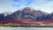 Panoramic view of snow mountain with colorful Autumn foliage