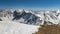 Panoramic view of snowy alps mountains in beautiful sunny winter nature