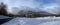 Panoramic view of the snowy Puy-de-Dome, hanging the clouds