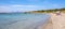 Panoramic view of Spiaggia Spalmatore di Terra beach of Isola Tavolara island on Tyrrhenian Sea off northern coast of Sardinia,