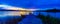 Panoramic view Sports Fishermen at Sunset early fall with beautiful water reflections skyline over Ed Zorinsky lake Omaha Nebraska