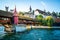 Panoramic view of Spreuer Bridge or SpreuerbrÃ¼cke covered footbridge and towers of Musegg wall in background Lucerne Switzerland