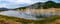 Panoramic view of steam rising from the lake from underlying geysers in Yellowstone National Park, MO, USA