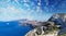 Panoramic view of steep island road with ocean and mountains