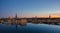 Panoramic view of Stockholm city at dawn, reflected over frozen water.