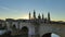 Panoramic view of the stone bridge and the Basilica del Pilar at sunset in Zaragoza, Spain