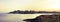 Panoramic view of sun setting over horizon at cabo de palos seascape in Murcia, Spain