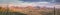 Panoramic view of sunrise against Tucson mountains