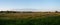 Panoramic view during sunset over the farmlands in the outskirts of the university town of Lund, Sweden