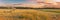 Panoramic View Of Sunset Sky Above Irrigation Pivot. Irrigation Machine At Agricultural Field With Young Sprouts, Green
