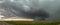 Panoramic view of supercell thunderstorm over the high plains in Oklahoma with a dramatic green sky