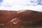 Panoramic view on surreal abstract red burning volcanic mountain MontaÃ±as del Fuego against blue sky in Timanfaya NP, Lanzarote