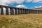 A panoramic view of the sweeping majestic Ribblehead Viaduct stands tall above the Ribble Valley, Yorkshire, England