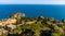 Panoramic view of Taormina with Capo Mazzaro cape and residential estates on Ionian sea shore in Messina region of Sicily in Italy