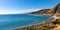 Panoramic view of Taormina shore at Ionian sea with Giardini Naxos and Villagonia towns and Mount Etna in Sicily in Italy