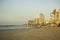 Panoramic view of Tel-Aviv beach on a morning with tourists behind