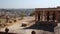 Panoramic view of temple ruins and Jodhpur cityscape in background.