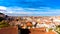 Panoramic view on terracotta rooftops with clouds on the sky in
