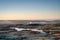 Panoramic view of Tittesworth Reservoir from The Roaches, with the Long Mynd, and The Wrekin in the distance at sunrise in the