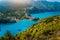 Panoramic view to Assos village Kefalonia. Greece. White lonely yacht in beautiful turquoise colored bay lagoon water