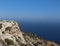 Panoramic view to the sea with the view to island Filfla in Malta. Smal island near Malta coast. Dingle clips in Mata and scenic