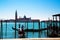 A panoramic view to the Venice lagoon, San Giorgio Maggiore island, to gondolas with tourists and gondolier moving to the San