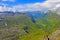 Panoramic view from top of Dalsnibba on Nibbevegen road leading down to Geiranger Fjord, Norway