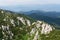 Panoramic view from the top of mountain to many mountain peaks around