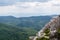 Panoramic view from the top of mountain to many mountain peaks around