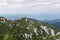 Panoramic view from the top of mountain to many mountain peaks around